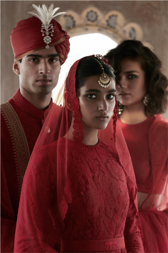 Photo of A bride dressed in a red Sabyasachi lehenga on her wedding day